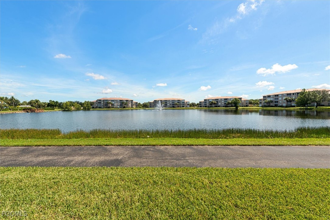 14111 Brant Point Circle, Unit 2106 Fort Myers, FL 33919 - Photo 13 of 31 a view of a lake with houses in the back