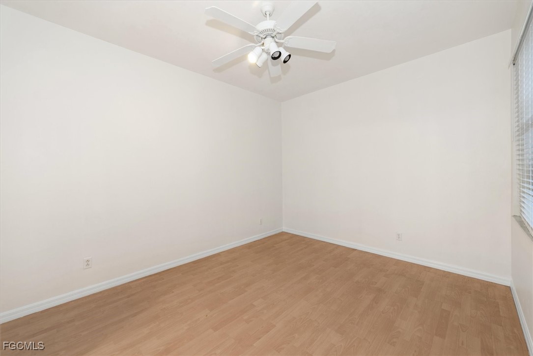 14111 Brant Point Circle, Unit 2106 Fort Myers, FL 33919 - Photo 17 of 31 an empty room with a fan & a ceiling fan
