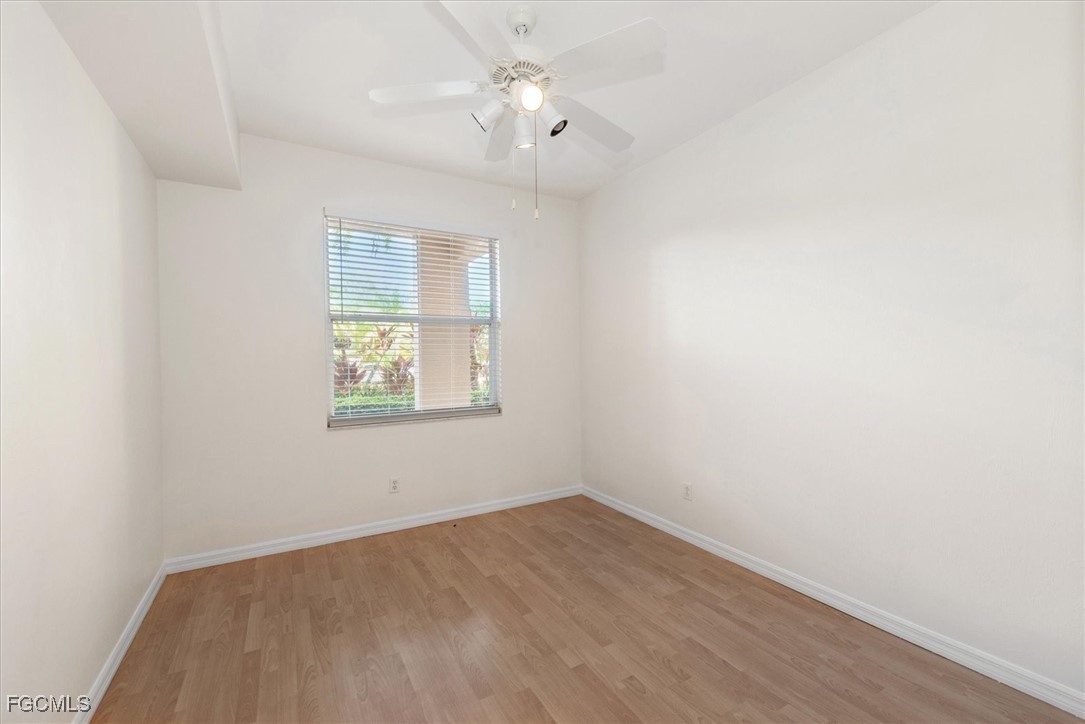 14111 Brant Point Circle, Unit 2106 Fort Myers, FL 33919 - Photo 18 of 31 an empty room with a window and ceiling fan