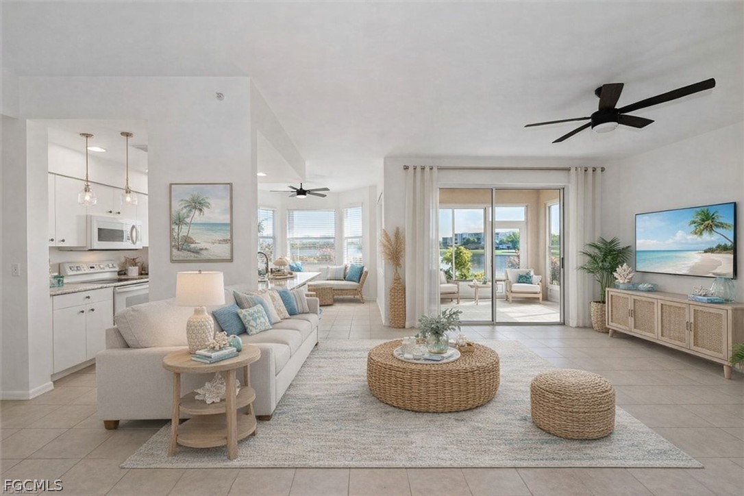 14111 Brant Point Circle, Unit 2106 Fort Myers, FL 33919 - Photo 4 of 31 a living room with furniture and a large window