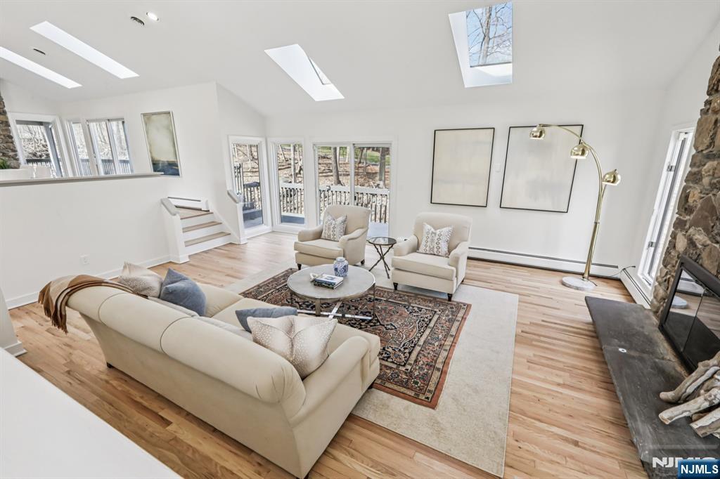 11 Carlough Road Upper Saddle River, NJ 07458 - Photo 6 of 41 a living room with furniture and wooden floor