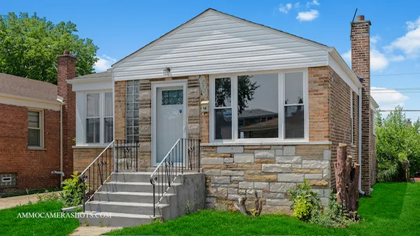 front view of a house with a yard
