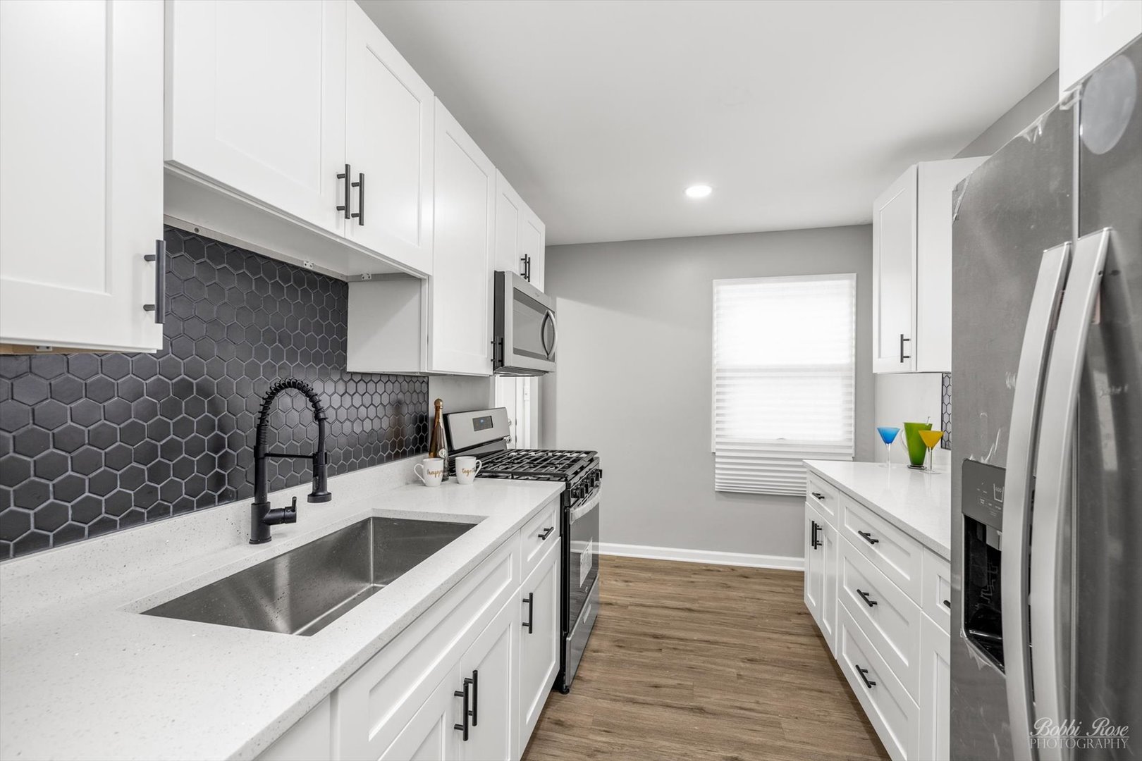 14 Salem Drive Joliet, IL 60436 - Photo 6 of 15 a kitchen with stainless steel appliances a sink stove and refrigerator