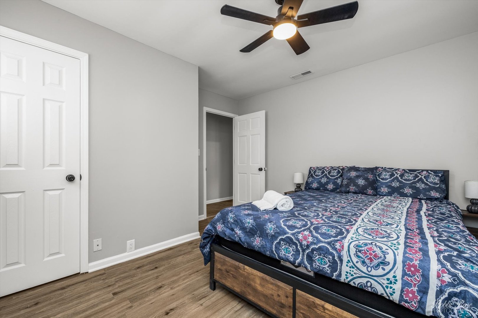 14 Salem Drive Joliet, IL 60436 - Photo 9 of 15 a bedroom with a large bed and wooden floor