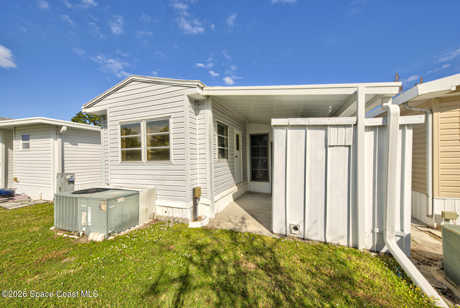283 Buffalo Place Rockledge, FL 32955 - Photo 4 of 23 a front view of a house with a yard