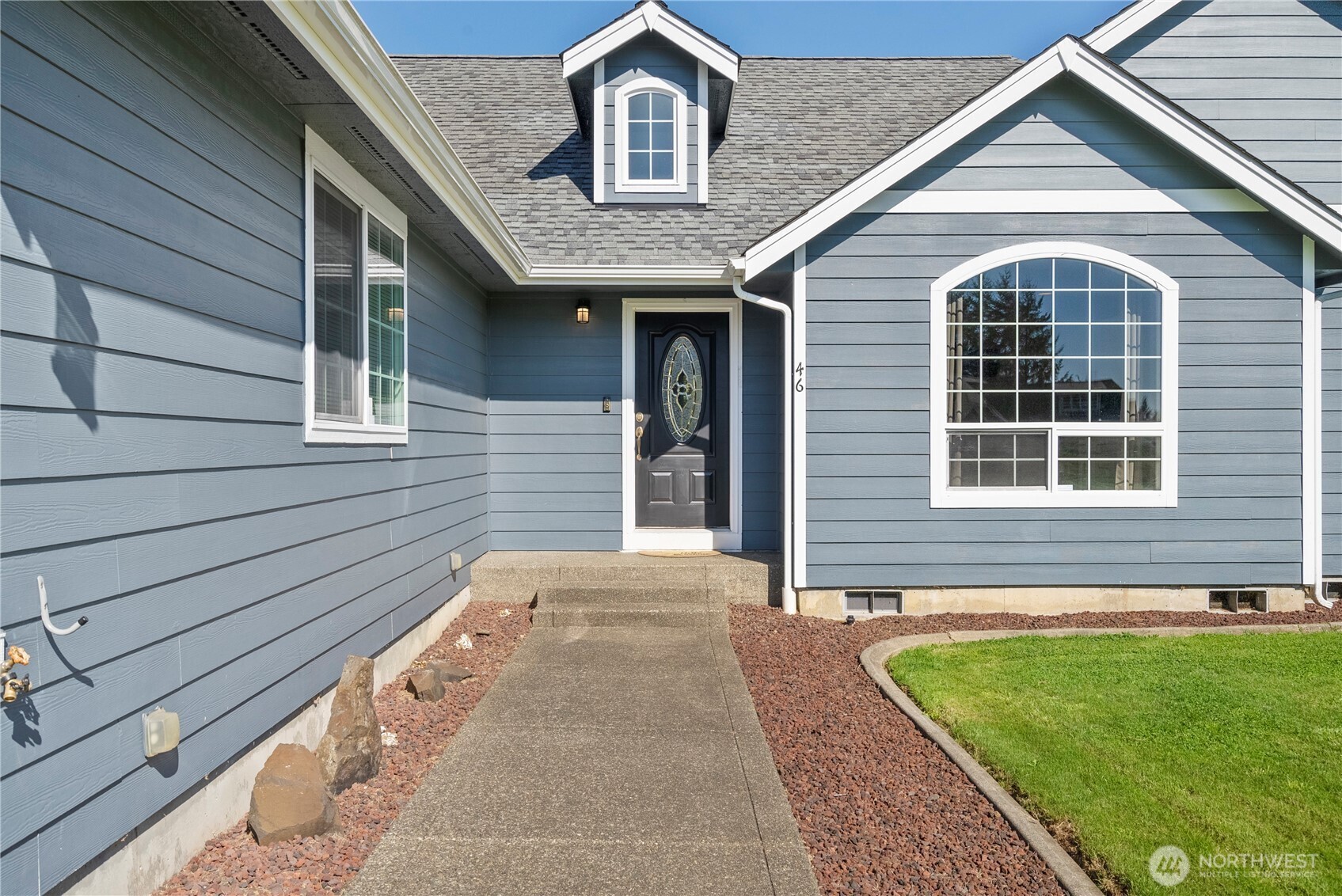 46 Richard Lane Elma, WA 98541 - Photo 3 of 40 a front view of a house with a garden
