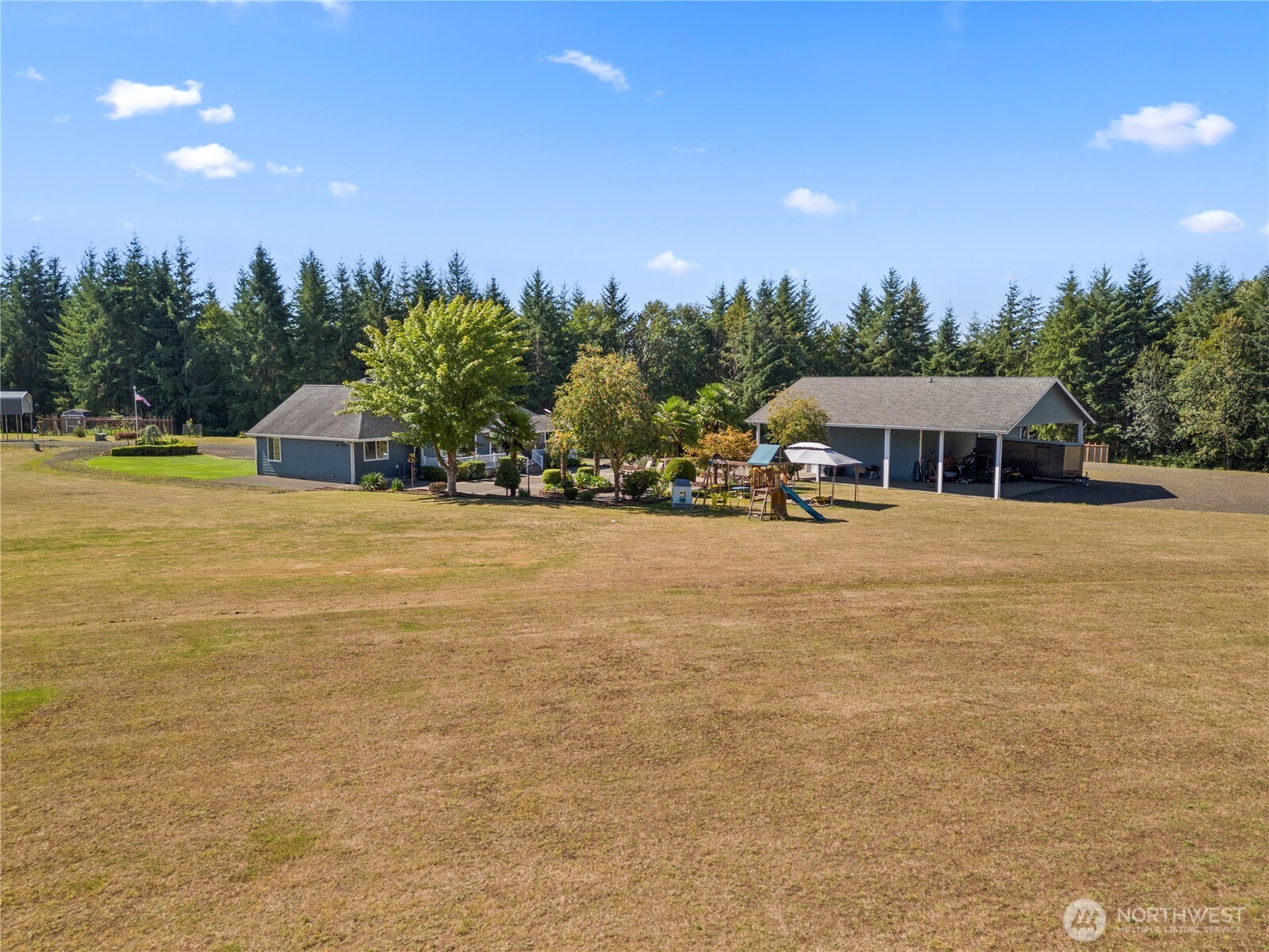 46 Richard Lane Elma, WA 98541 - Photo 35 of 40 a view of swimming pool with outdoor seating and yard in the back