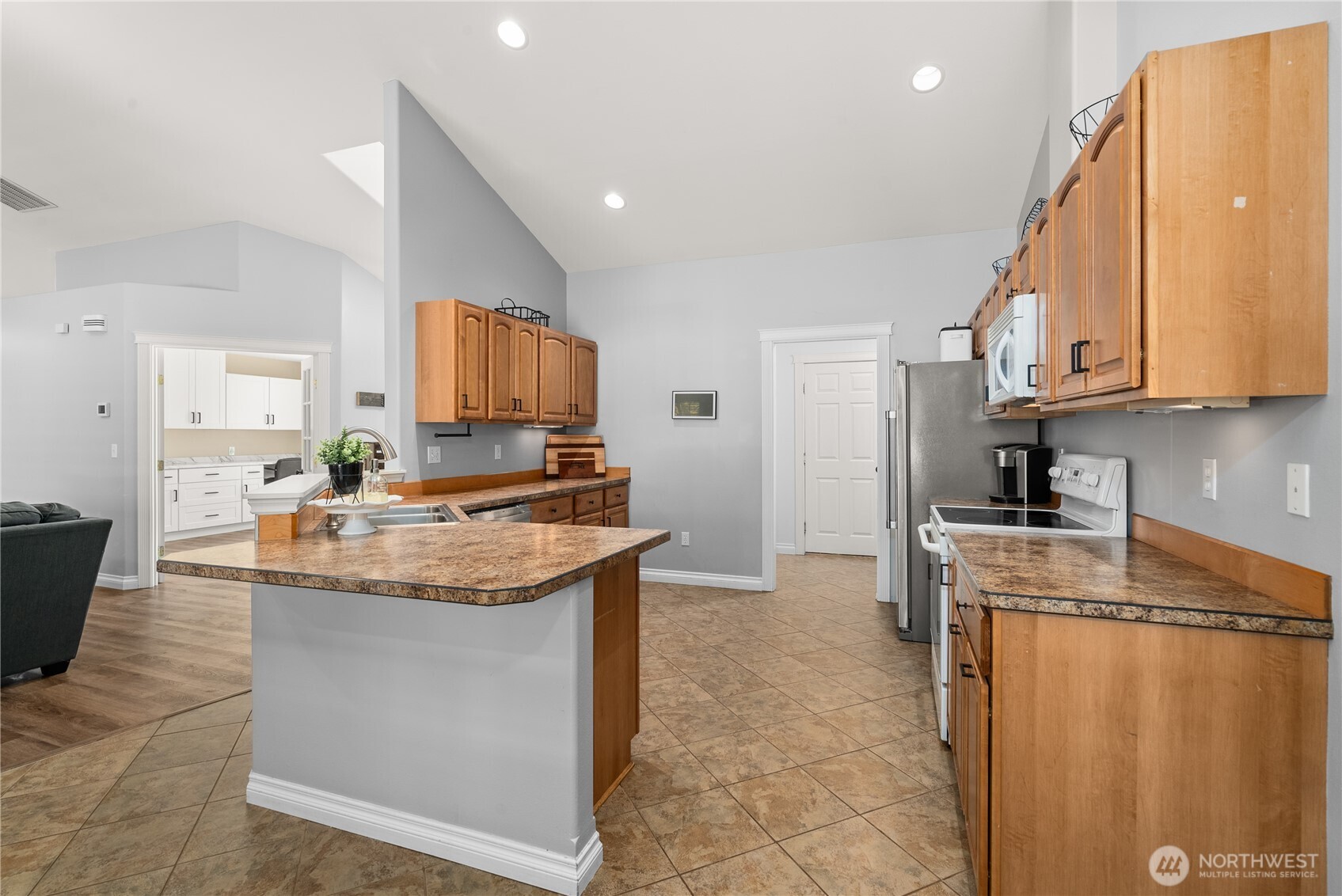 46 Richard Lane Elma, WA 98541 - Photo 9 of 40 a kitchen with granite countertop a sink and cabinets