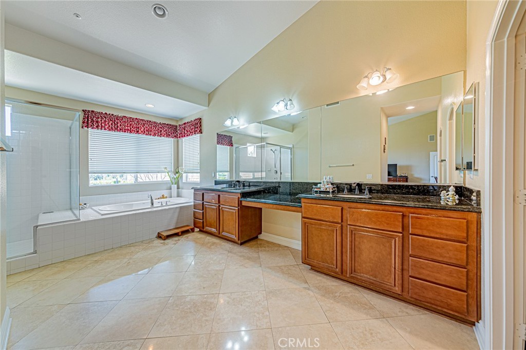 4088 Shady Ridge Circle Corona, CA 92881 - Photo 32 of 47 a large bathroom with a large tub and sink