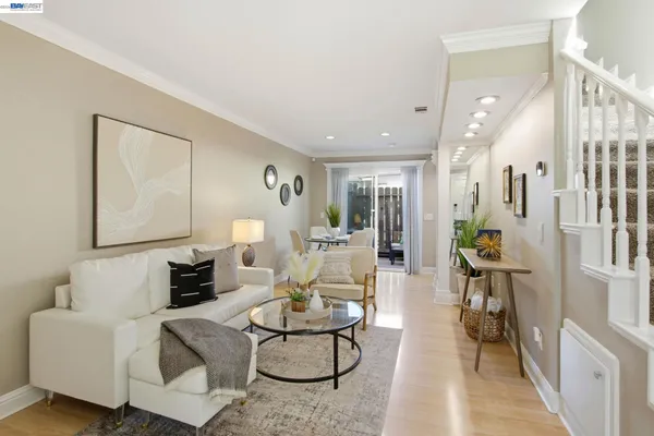 a living room with furniture and a table