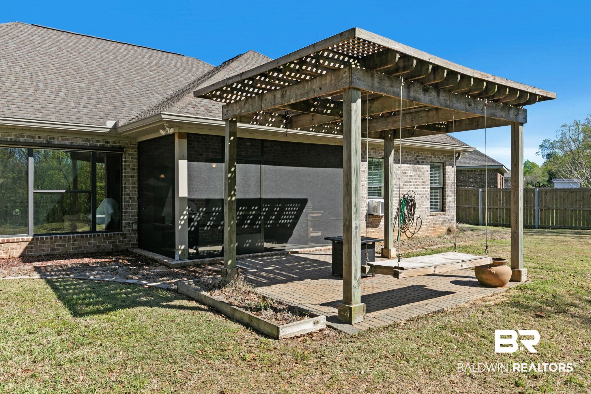 9584 Sanibel Loop Daphne, AL 36526 - Photo 41 of 48 Back of property with brick siding, a patio area, roof with shingles, and a pergola