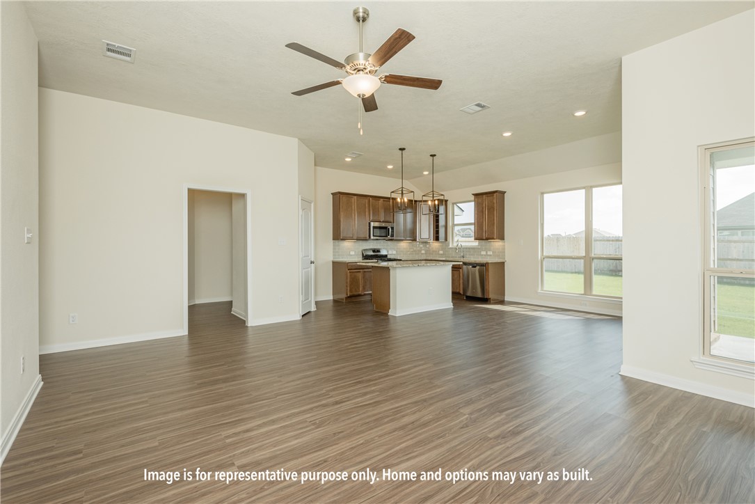 6402 Raleigh Loop College Station, TX 77845 - Photo 4 of 8 a view of a kitchen with a sink and a window