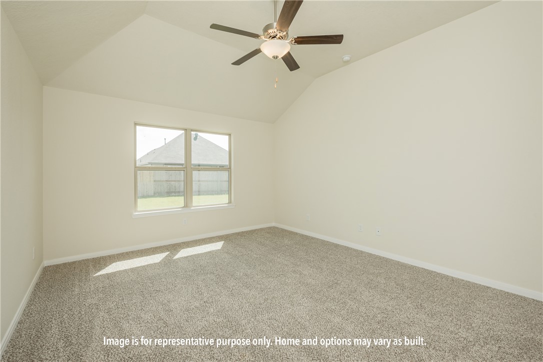 6402 Raleigh Loop College Station, TX 77845 - Photo 7 of 8 an empty room with a window and a ceiling fan