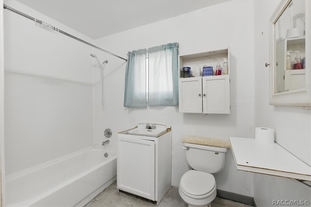 6 62nd Street Yankeetown, FL 34498 - Photo 39 of 55 a white toilet sitting next to a bath tub