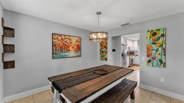 a bedroom with furniture and a chandelier