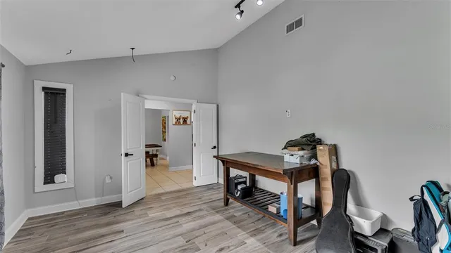 a room that has a bed and a chair in it