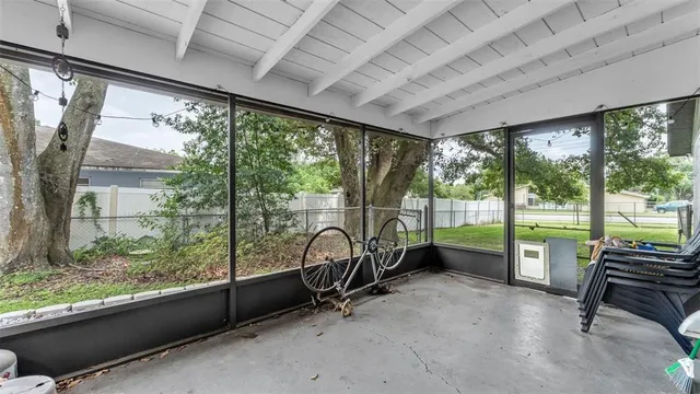 a view of a room with porch and wooden floor