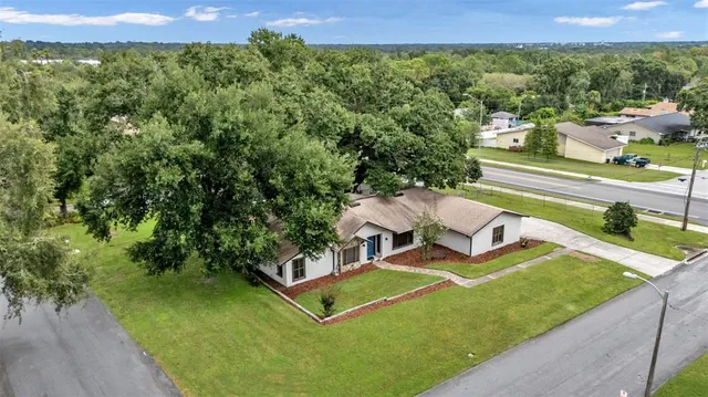 a view of a balcony with table and chairs