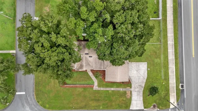 an aerial view of a house with swimming pool