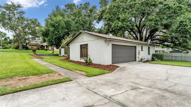 a view of backyard of house and outdoor space