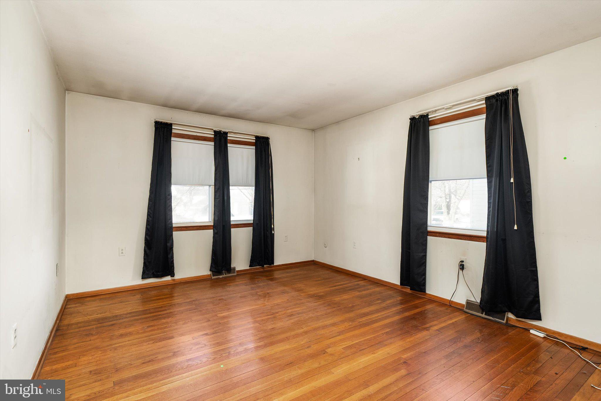 179 Saybrook Avenue Hamilton, NJ 08619 - Photo 17 of 26 a view of empty room with wooden floor and fan