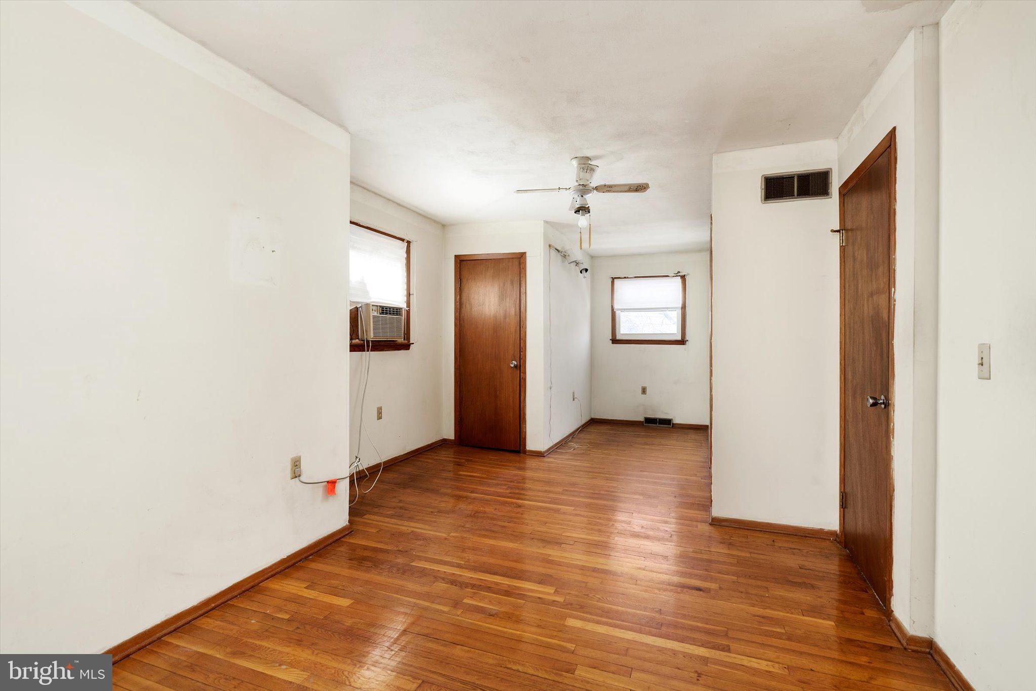179 Saybrook Avenue Hamilton, NJ 08619 - Photo 20 of 26 a view of a livingroom with wooden floor and kitchen space