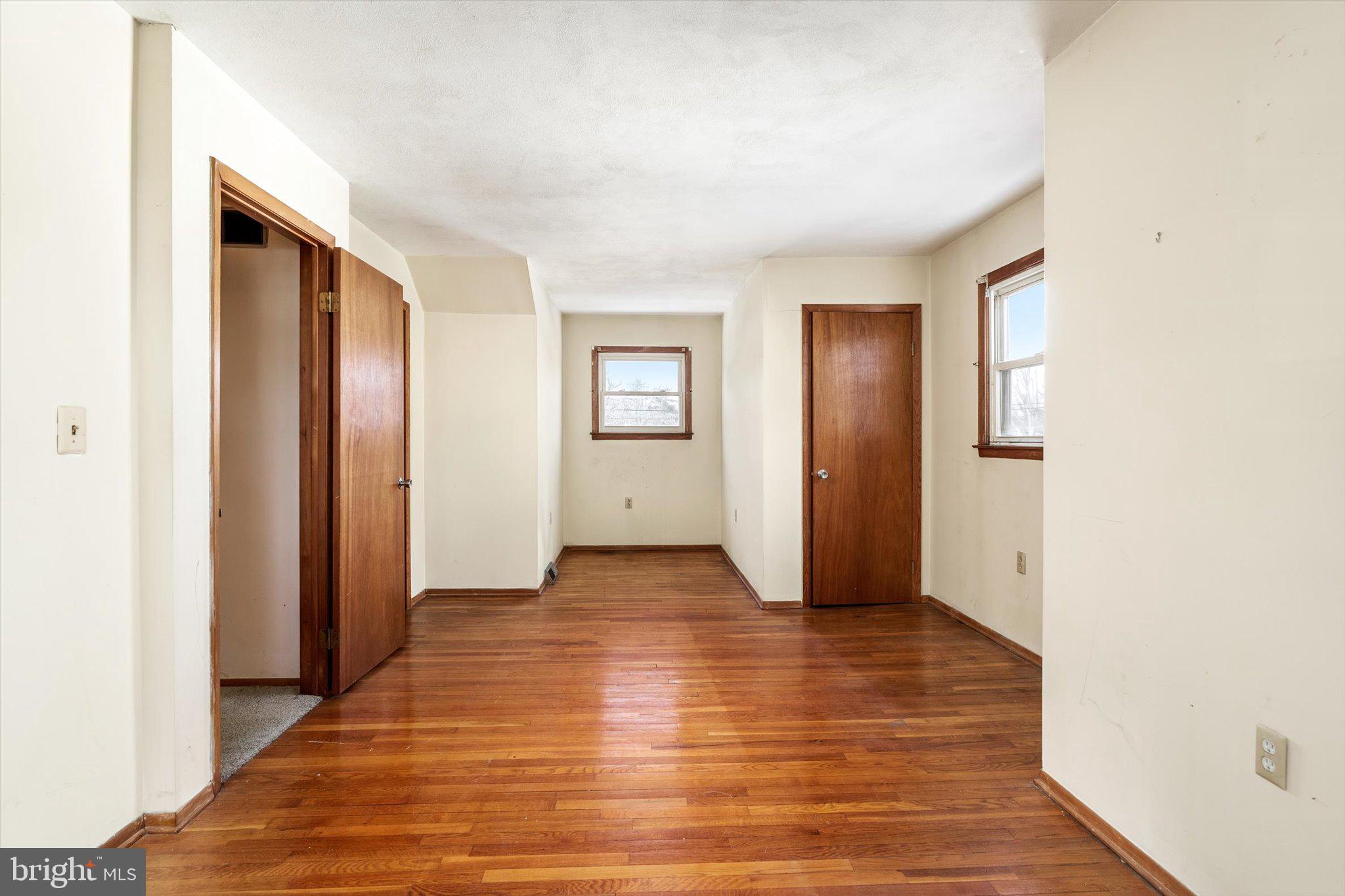 179 Saybrook Avenue Hamilton, NJ 08619 - Photo 23 of 26 a view of an empty room with wooden floor