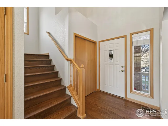 a view of entryway with wooden floor