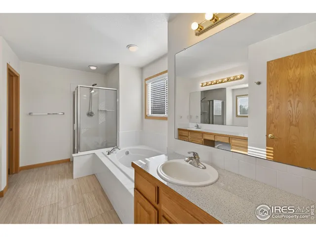 a bathroom with a sink a mirror and a bathtub
