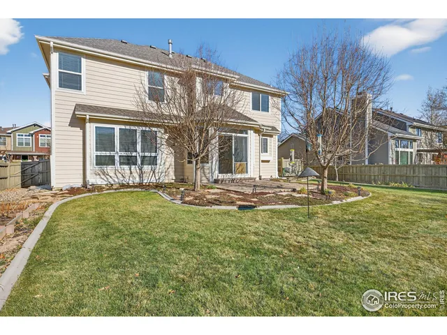 a swimming pool with outdoor seating