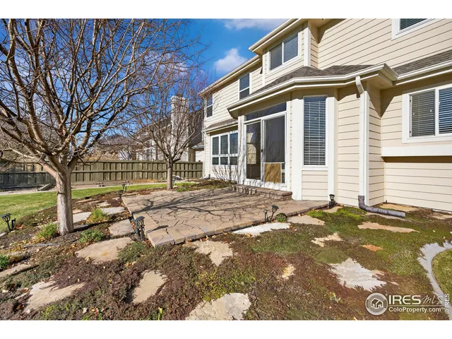 a view of a yard with a large tree