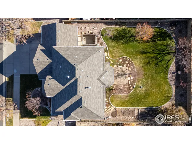 an aerial view of a house with a swimming pool