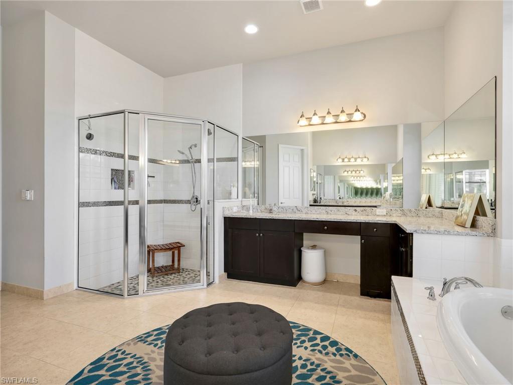 2756 Crystal Way Naples, FL 34119 - Photo 15 of 50 a spacious bathroom with a bathtub shower sink and toilet