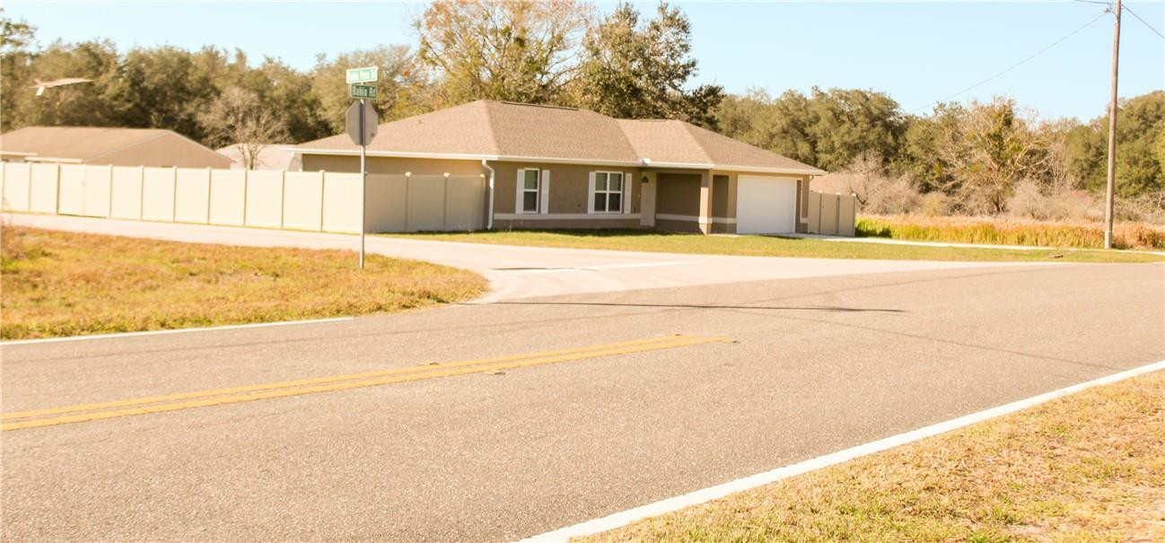 9643 Bahia Road Ocala, FL 34472 - Photo 1 of 16 a house with a outdoor space