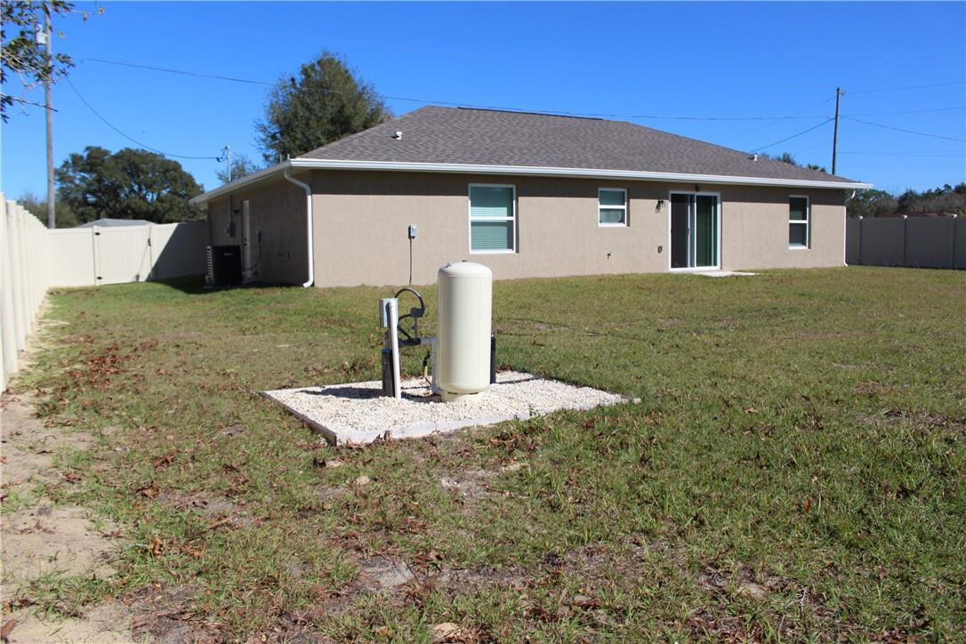 9643 Bahia Road Ocala, FL 34472 - Photo 13 of 16 a front view of a house with garden