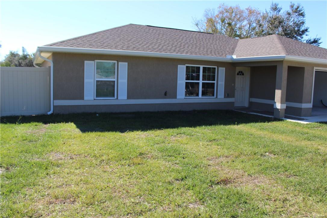 9643 Bahia Road Ocala, FL 34472 - Photo 2 of 16 a view of a house with a garden