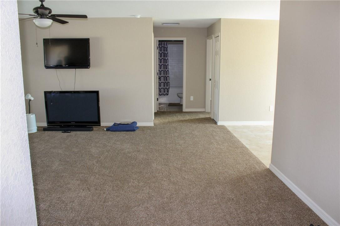 9643 Bahia Road Ocala, FL 34472 - Photo 5 of 16 a living room with furniture and a flat screen tv
