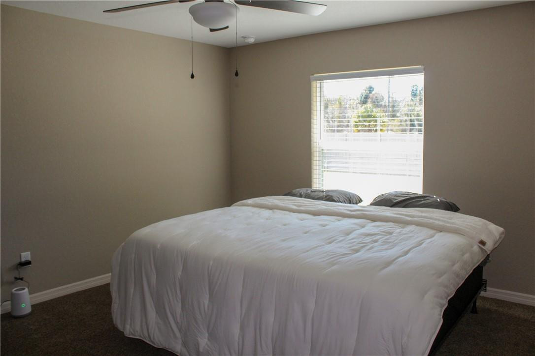 9643 Bahia Road Ocala, FL 34472 - Photo 8 of 16 a bedroom with a bed and a window