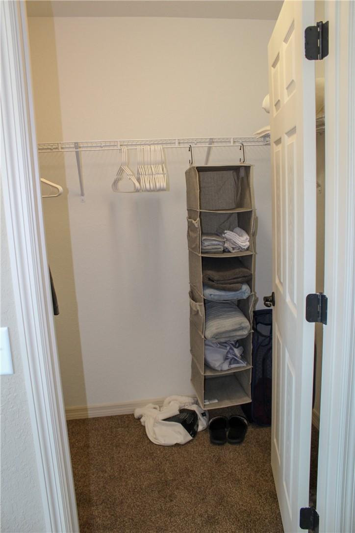 9643 Bahia Road Ocala, FL 34472 - Photo 9 of 16 a view of walk in closet with clothes and shoes