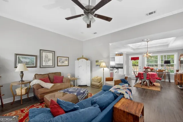 a living room with furniture and a rug