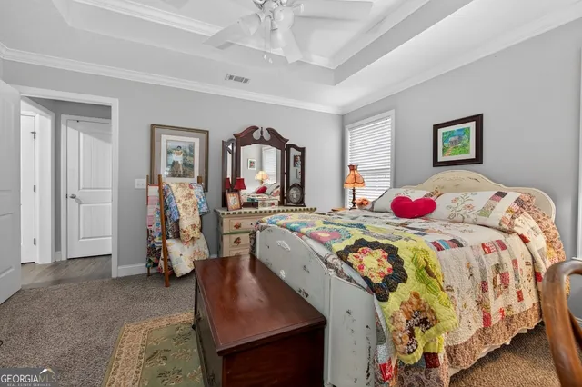 a bathroom with a sink a potted plant and a large mirror