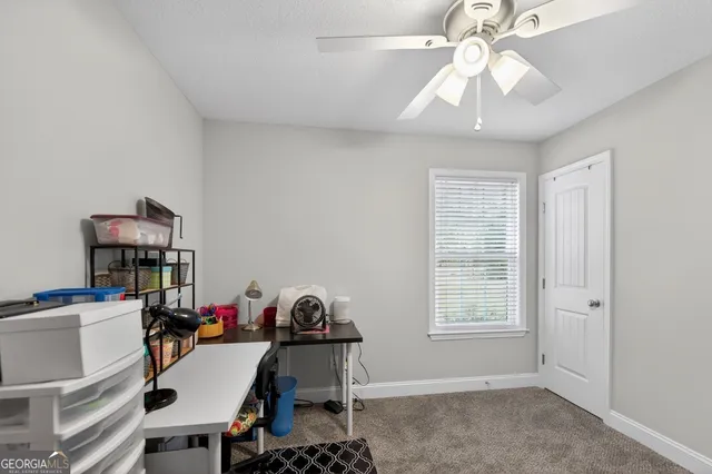 a view of a workspace with furniture