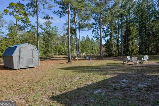 a view of a park with large trees