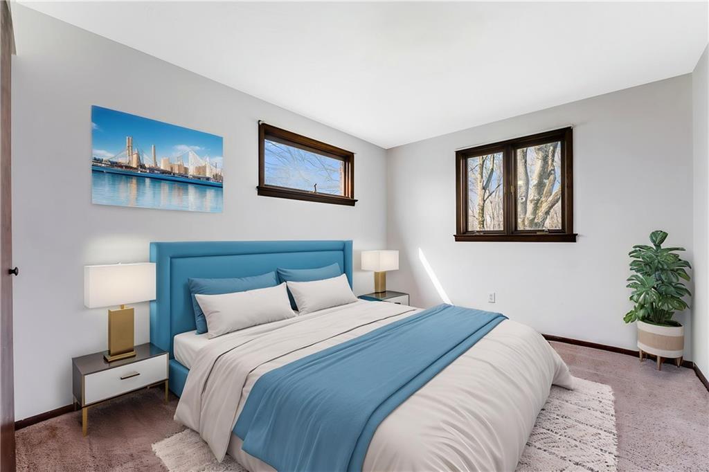 440 Steiner Bridge Road Valencia, PA 16059 - Photo 11 of 45 a bedroom with a bed and a potted plant