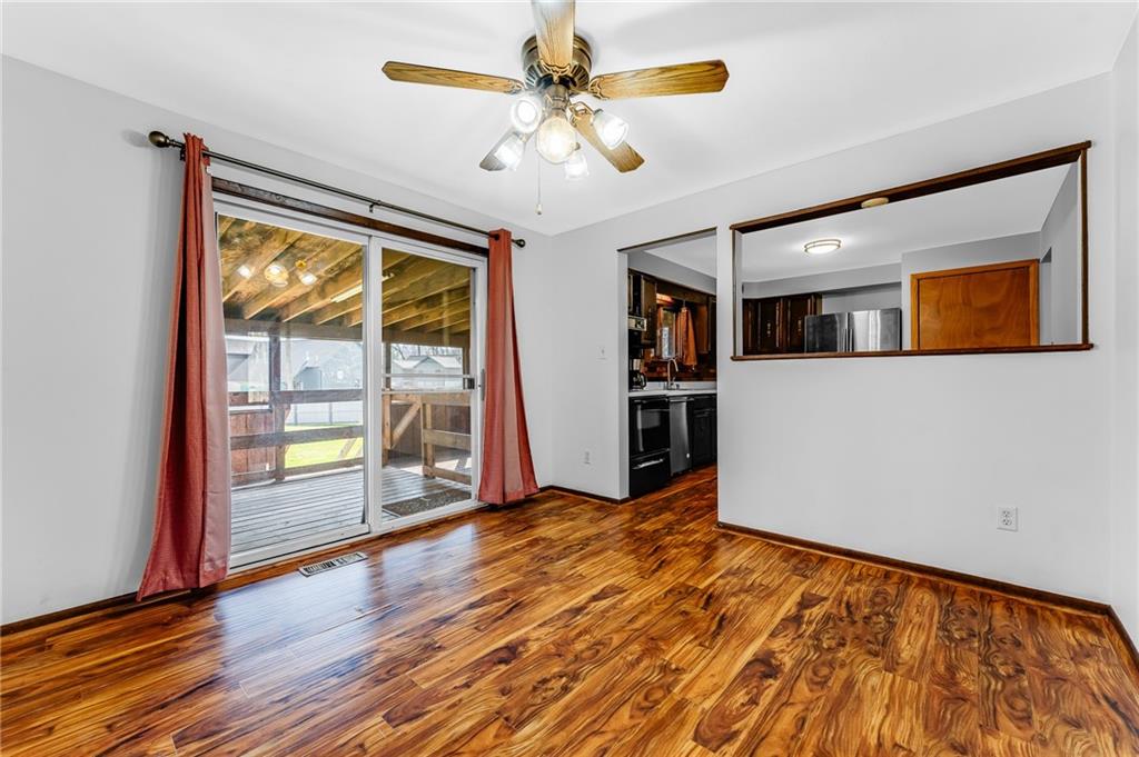 440 Steiner Bridge Road Valencia, PA 16059 - Photo 19 of 45 a view of an empty room with window and wooden floor