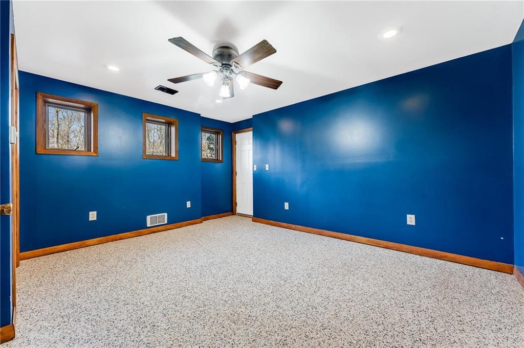 440 Steiner Bridge Road Valencia, PA 16059 - Photo 21 of 45 a view of an empty room with a chandelier fan