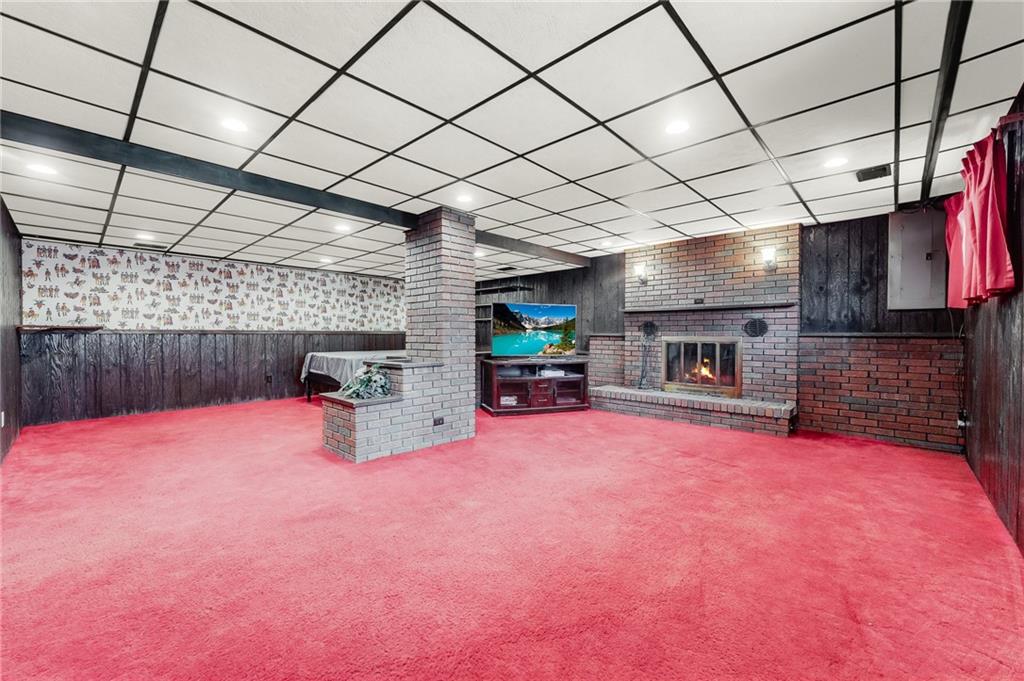 440 Steiner Bridge Road Valencia, PA 16059 - Photo 28 of 45 a room with furniture and a fireplace