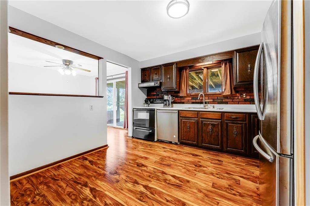 440 Steiner Bridge Road Valencia, PA 16059 - Photo 3 of 45 a kitchen with stainless steel appliances granite countertop a refrigerator sink and stove