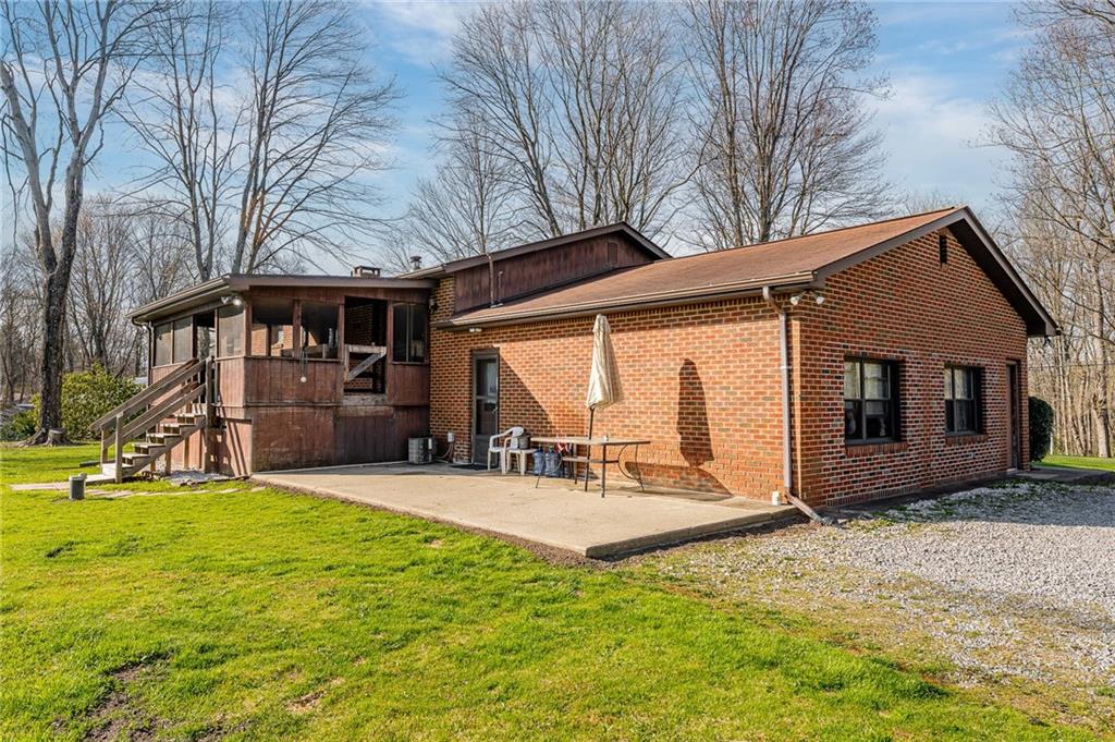 440 Steiner Bridge Road Valencia, PA 16059 - Photo 33 of 45 a view of a house with backyard porch and sitting area