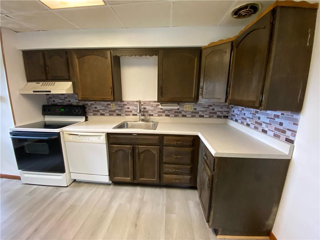 440 Steiner Bridge Road Valencia, PA 16059 - Photo 42 of 45 a kitchen with a sink stove and microwave